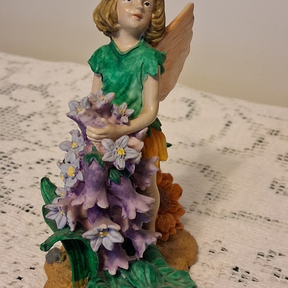 Charming Fairy Figurine with Green and Purple Accents